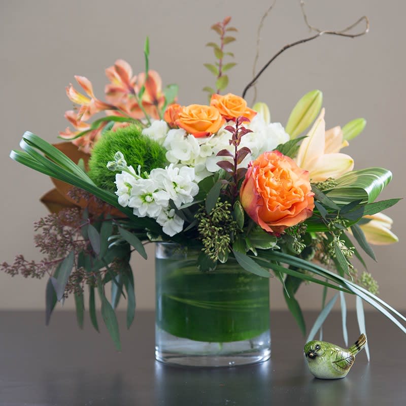 Peach, celery and white blooms. Stock, lily, hydrangea and roses arranged in