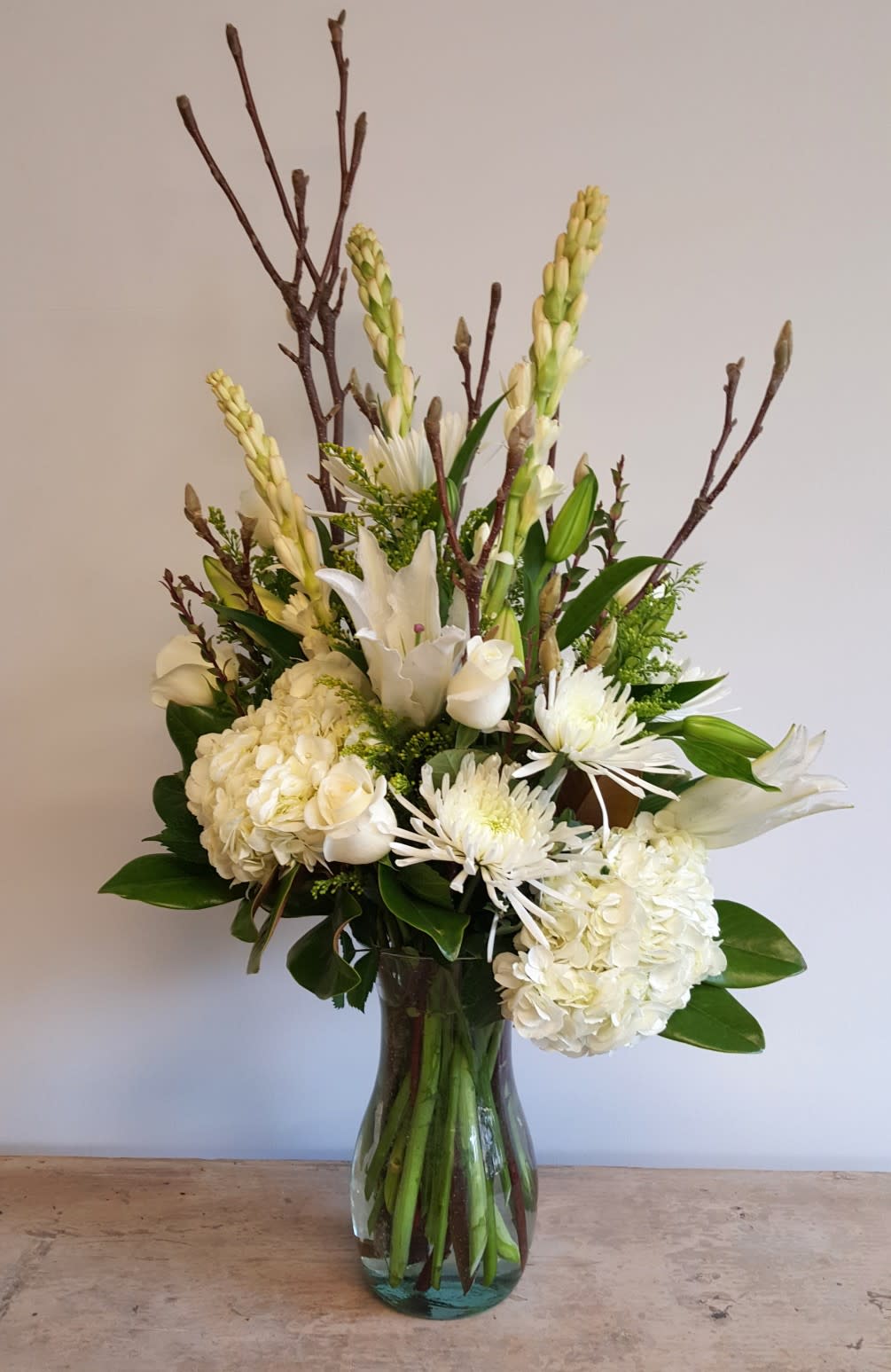 A wintery mix of flowers and foliage that is just perfect for