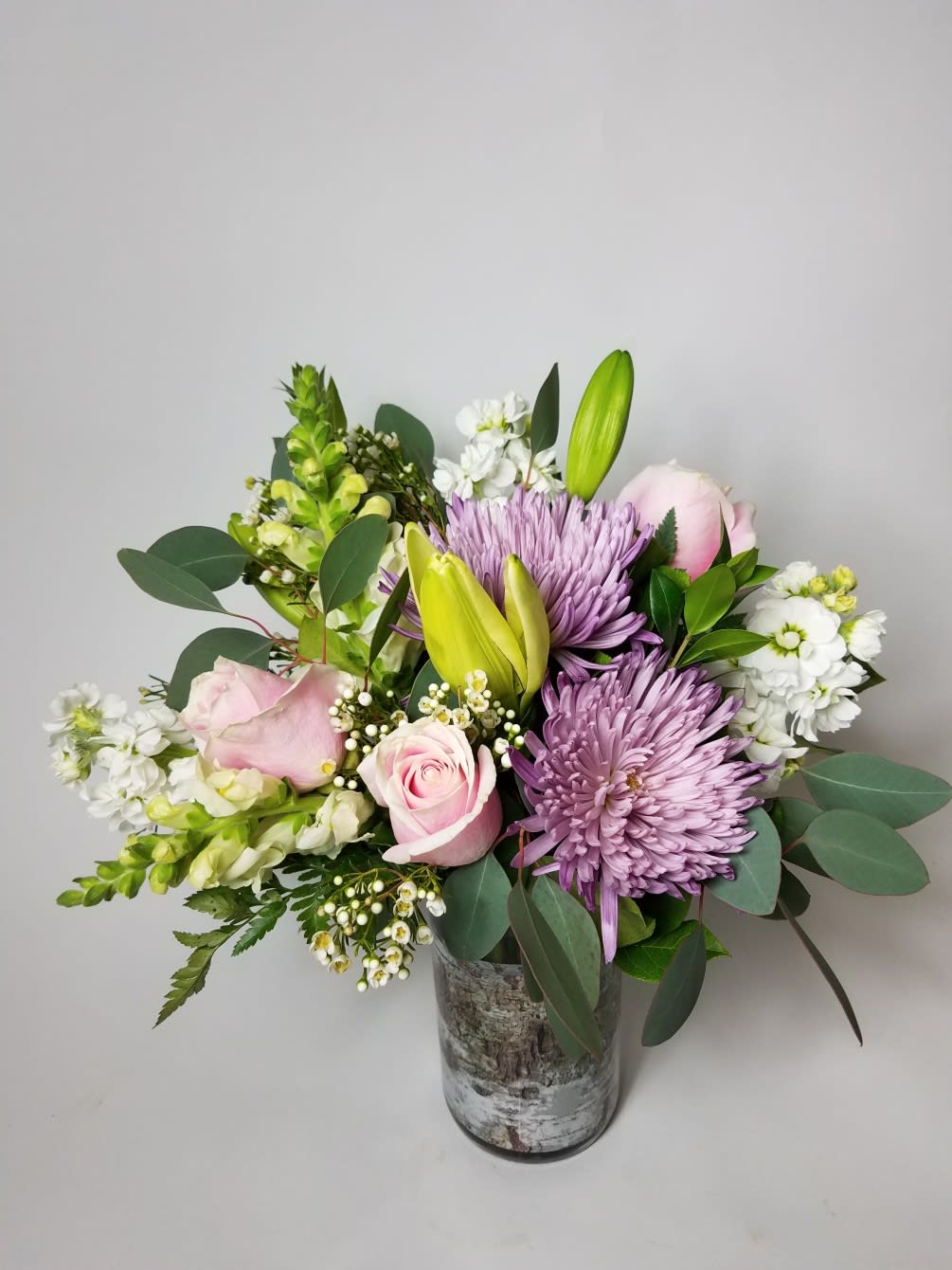 a pastel spring arrangement with oriental lilies. With fragrance and style anyone