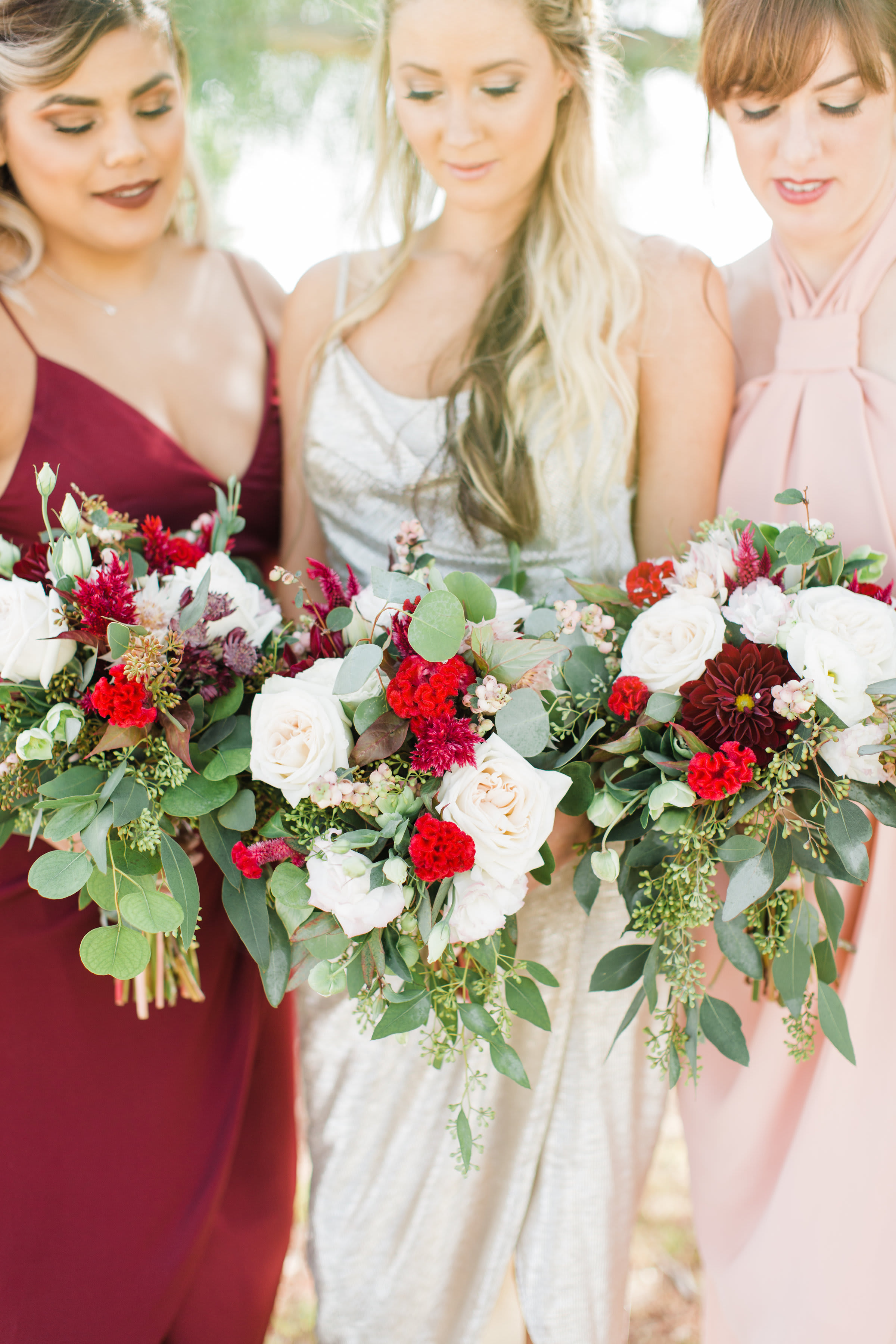Complimenting colors of dresses to flowers.