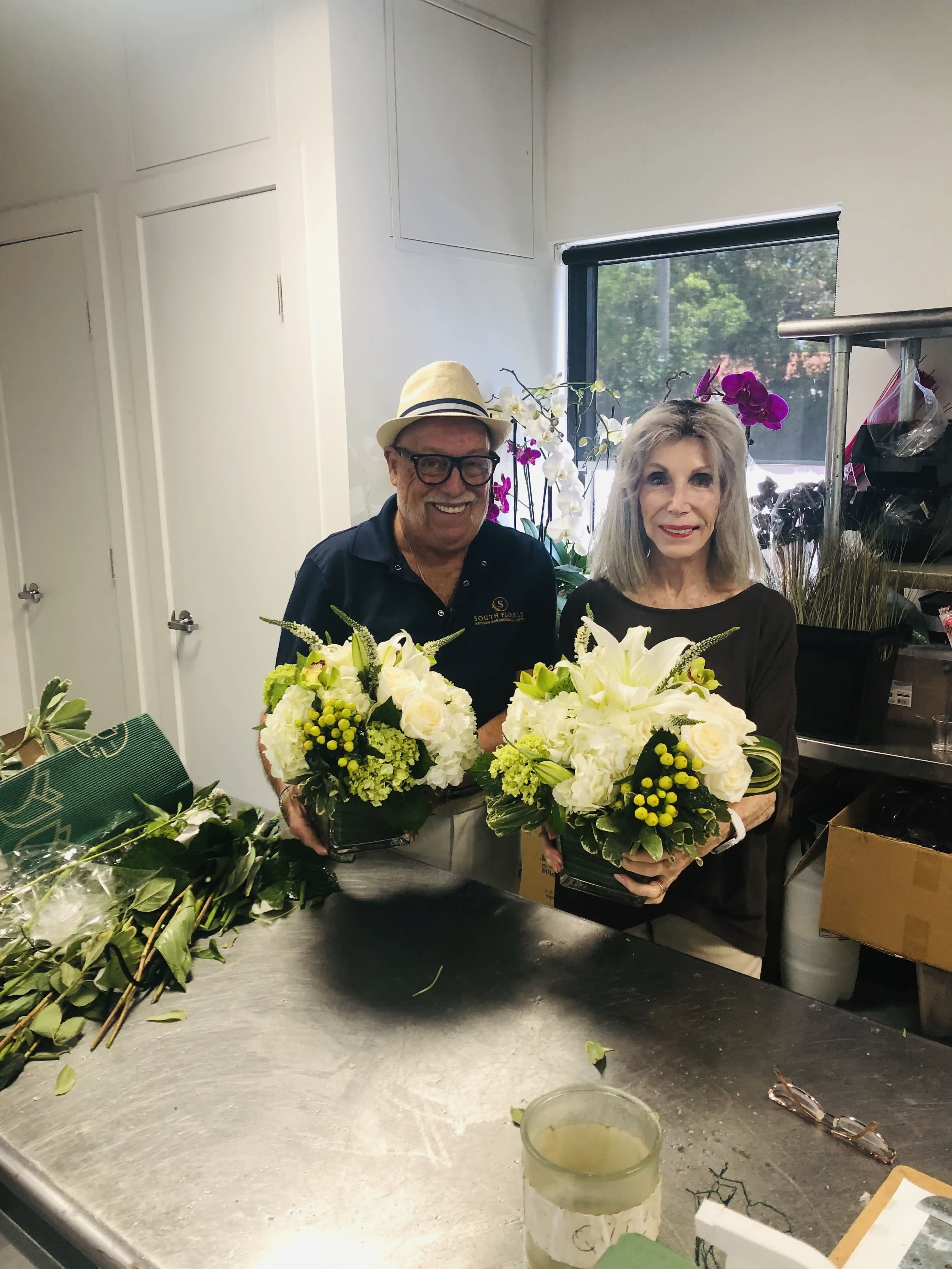 Group photo holding completed arrangements