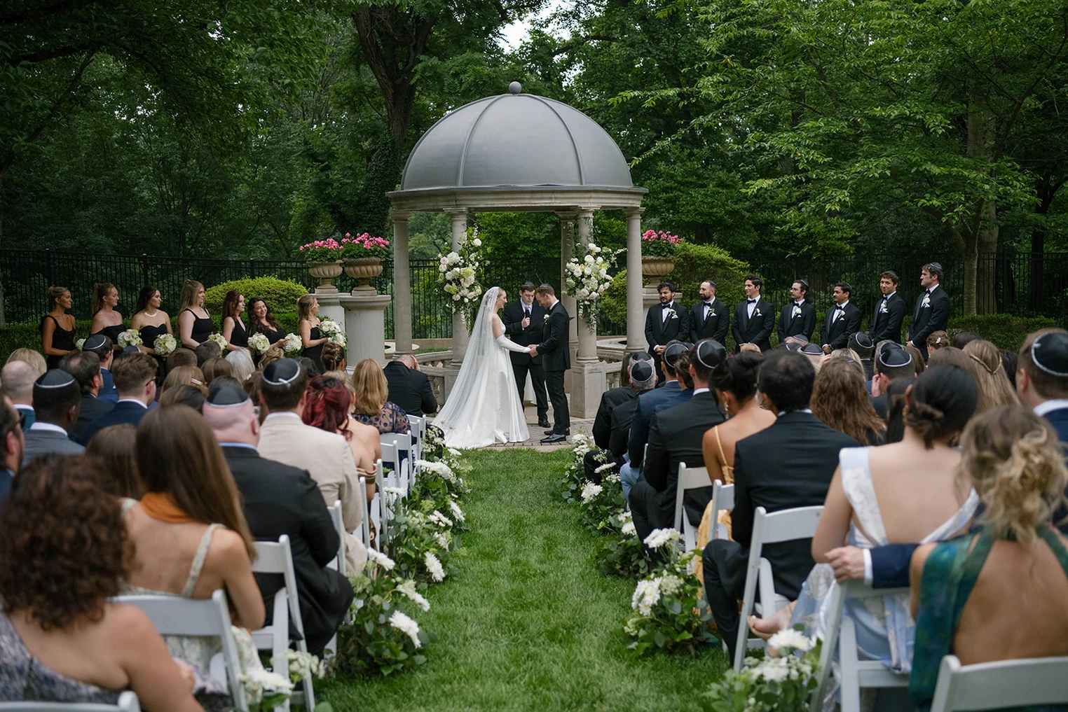 Couple getting married surrounded by florals