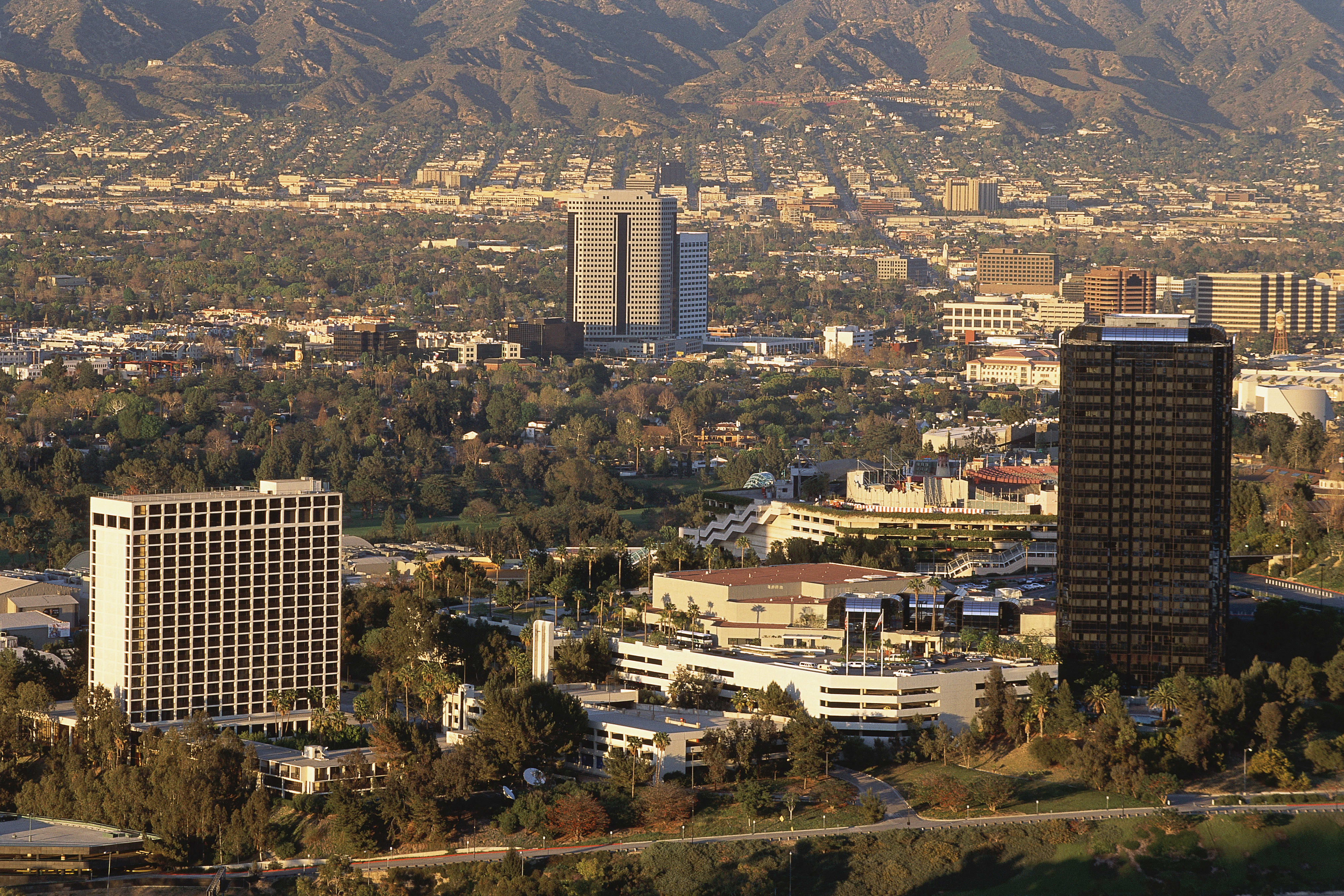 A an aerial view of office buildings and homes in Van Nuys on a sunny day.