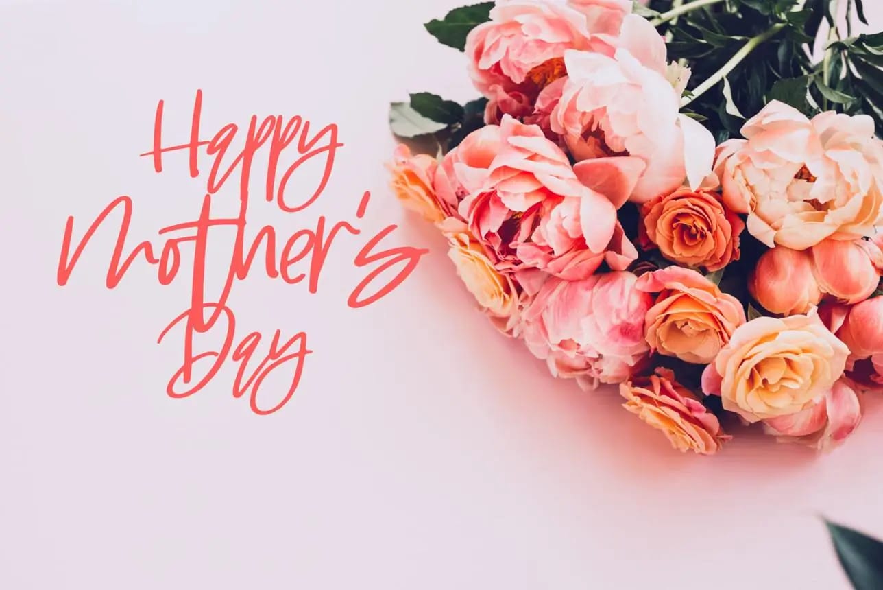 A bouquet of pink peonies and orange roses on a pink background for Mother’s Day flower delivery greeting card.