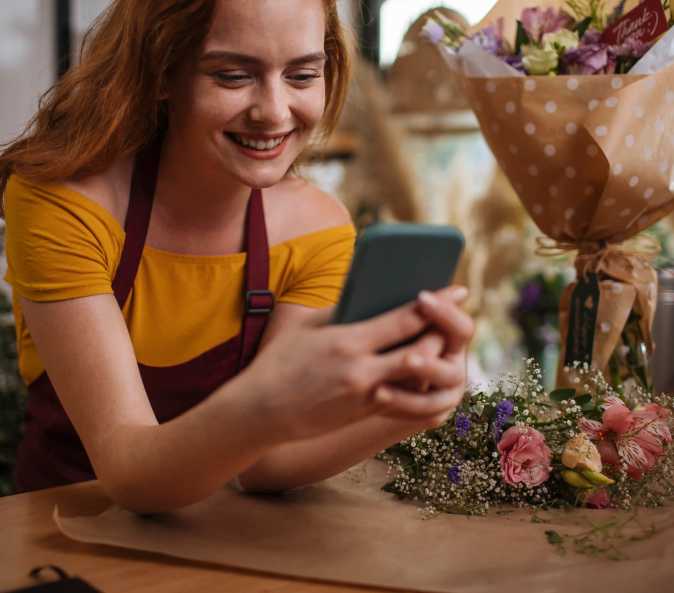 Person delivering a beautiful floral arrangement