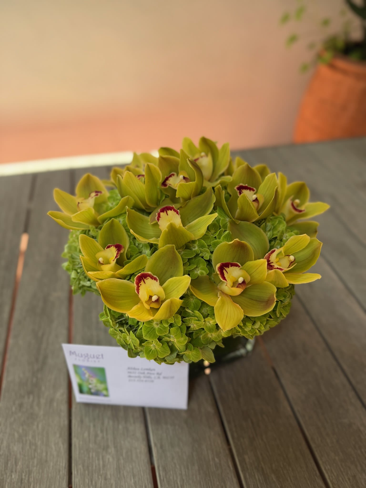 Lush Serenity: Green Cymbidium Orchids and Hydrangeas Arrangement