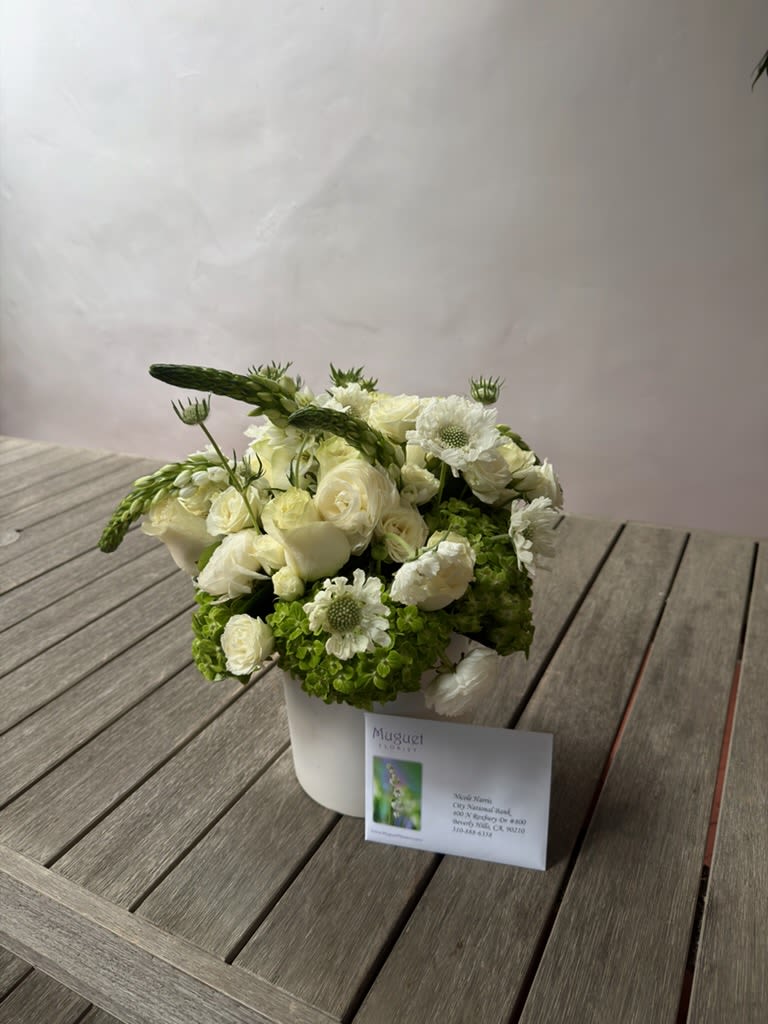 Teatime Elegance: A Pretty Green Cup Flower Arrangement