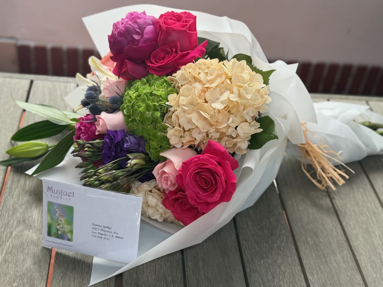 Blushing Harmony: A delicate blend of soft peonies and romantic roses, wrapped in elegance.