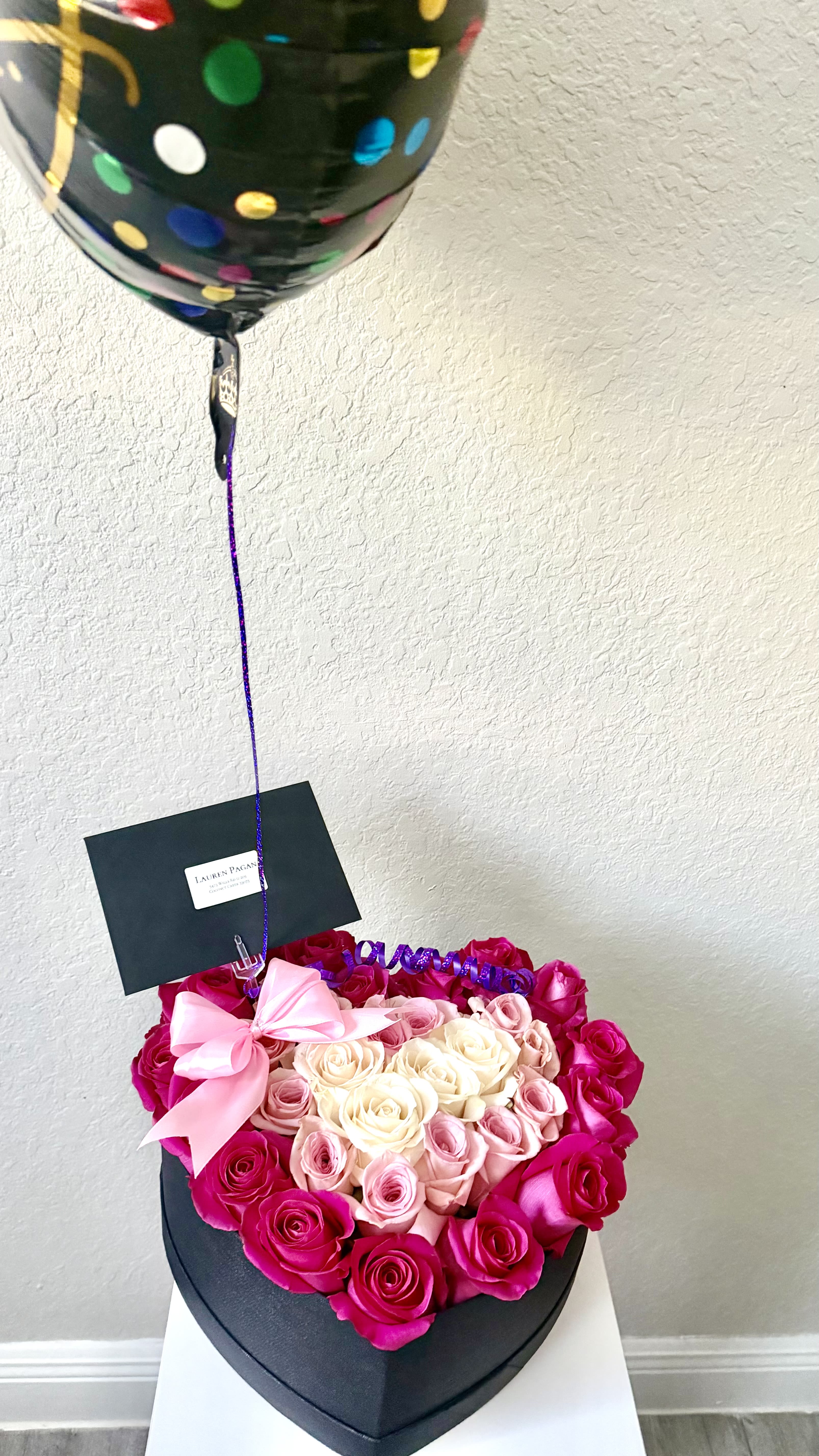 Black heart shaped box with roses
