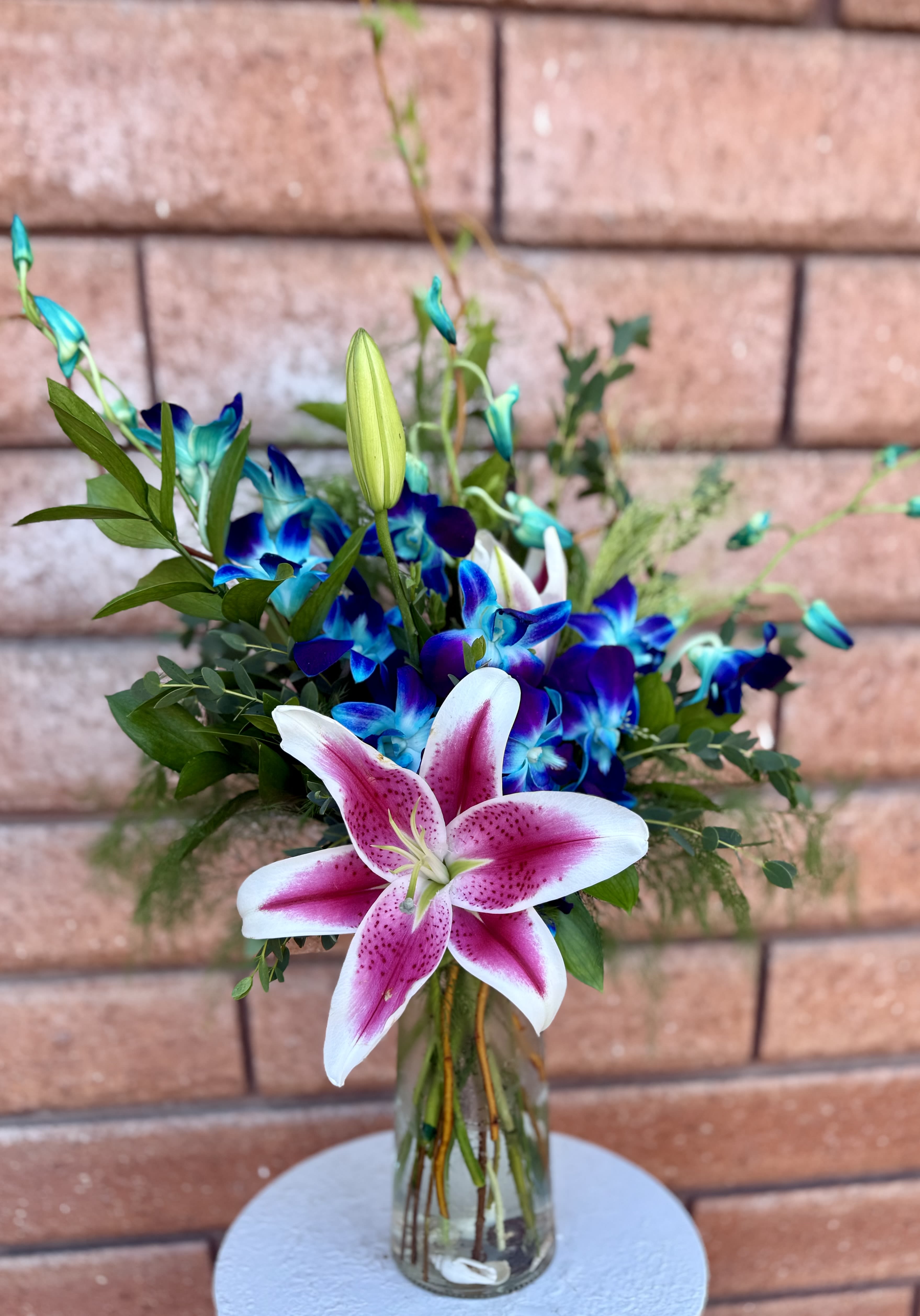 Blue Orchids and Stargazer Lily Vase