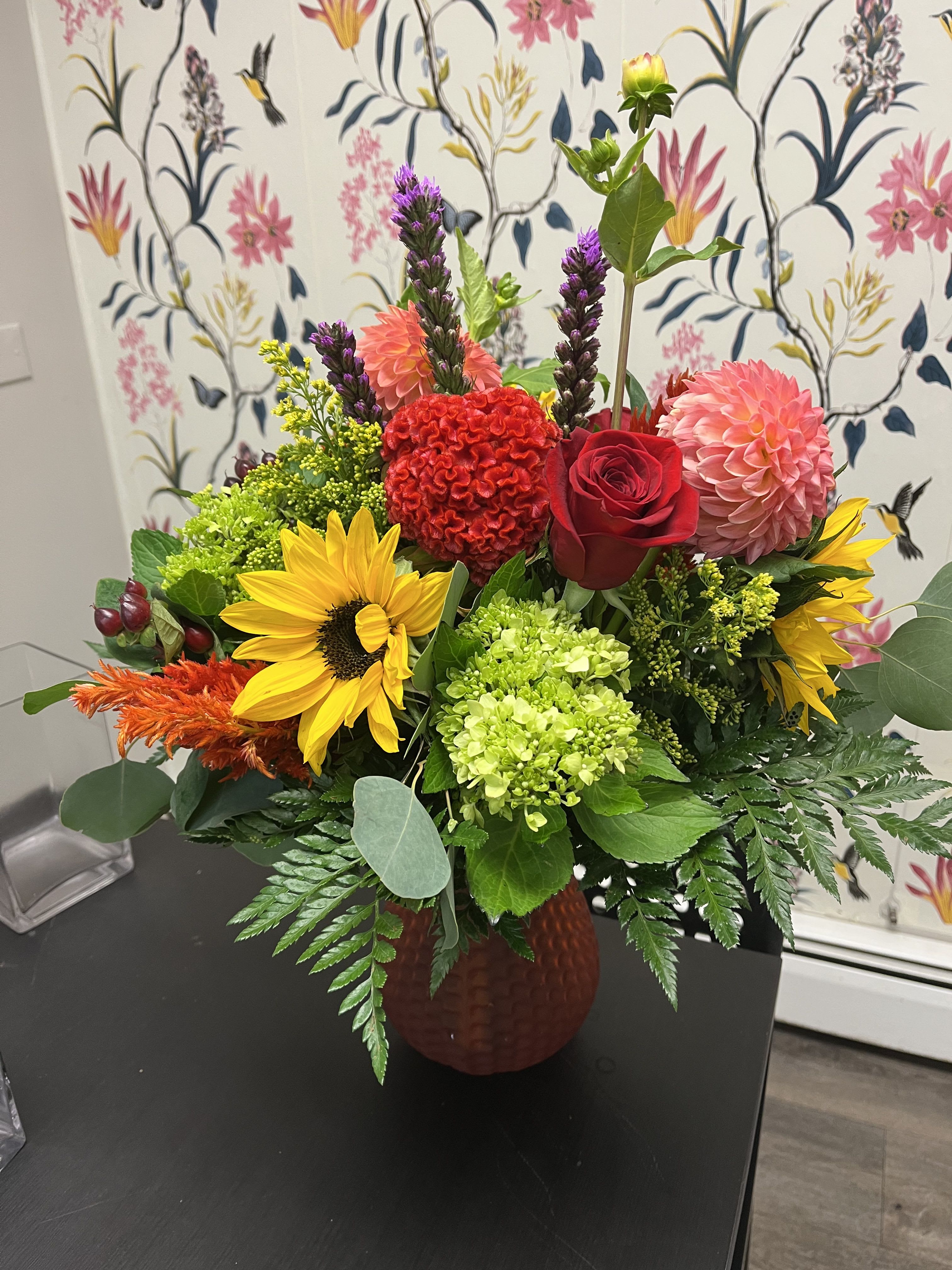 Kendra vase with designer’s choice late summer / early fall ( vase will be colored or clear) 