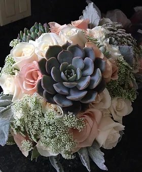 Pink roses and succulent bouquets