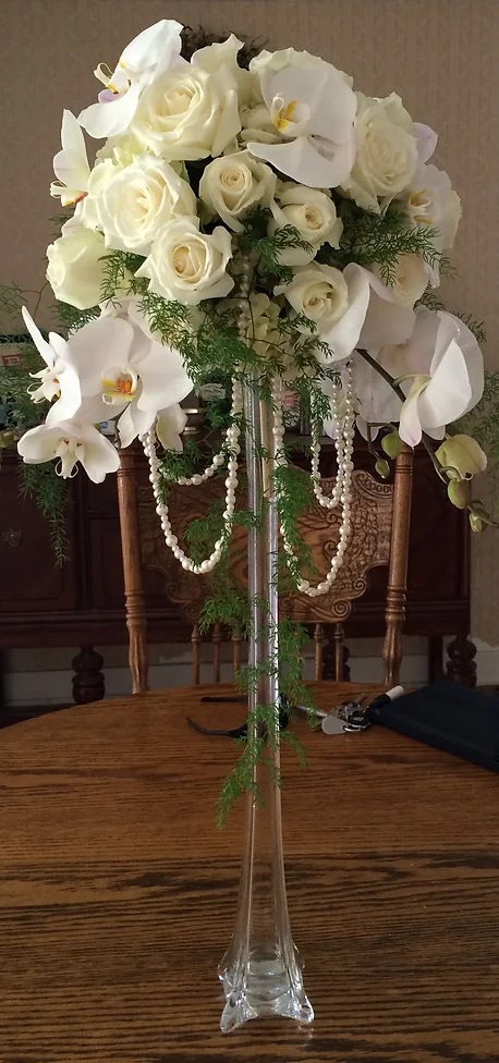 White roses and orchids centerpiece
