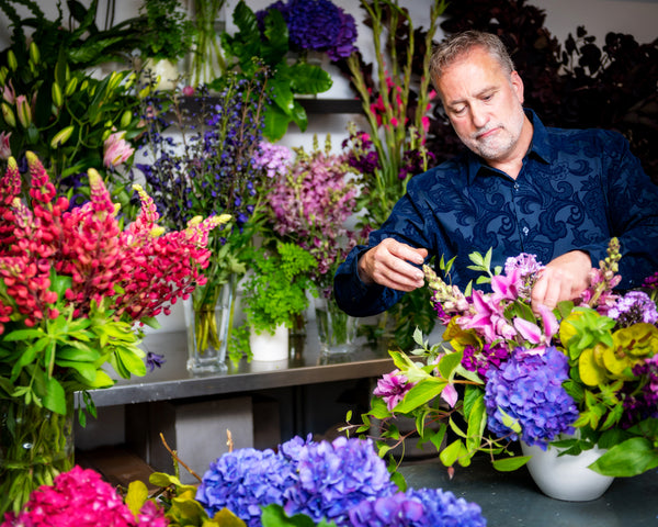 Josef Reiter working with flowers