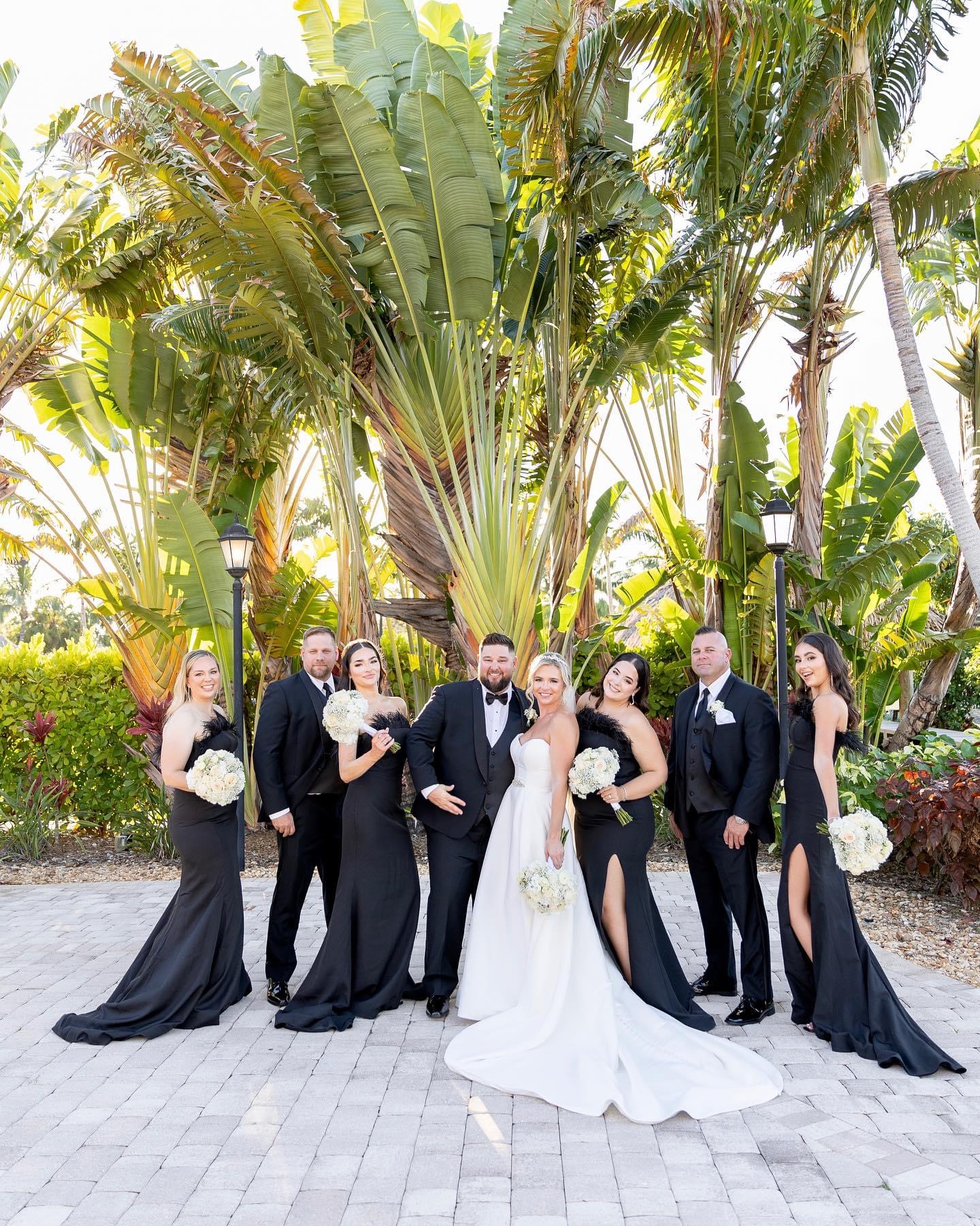 Wedding couple with floral arrangements around them