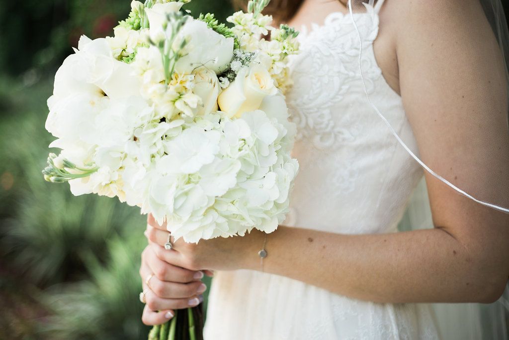 Woman Holding white bouquet