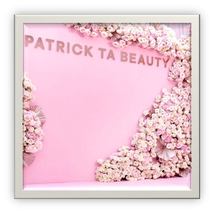 Pink backdrop with creeping floral designs around the border