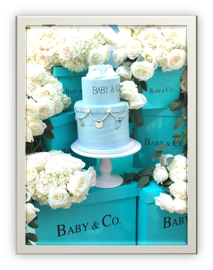 Blue cake on Tiffany & Co themed baby boxes and white florals
