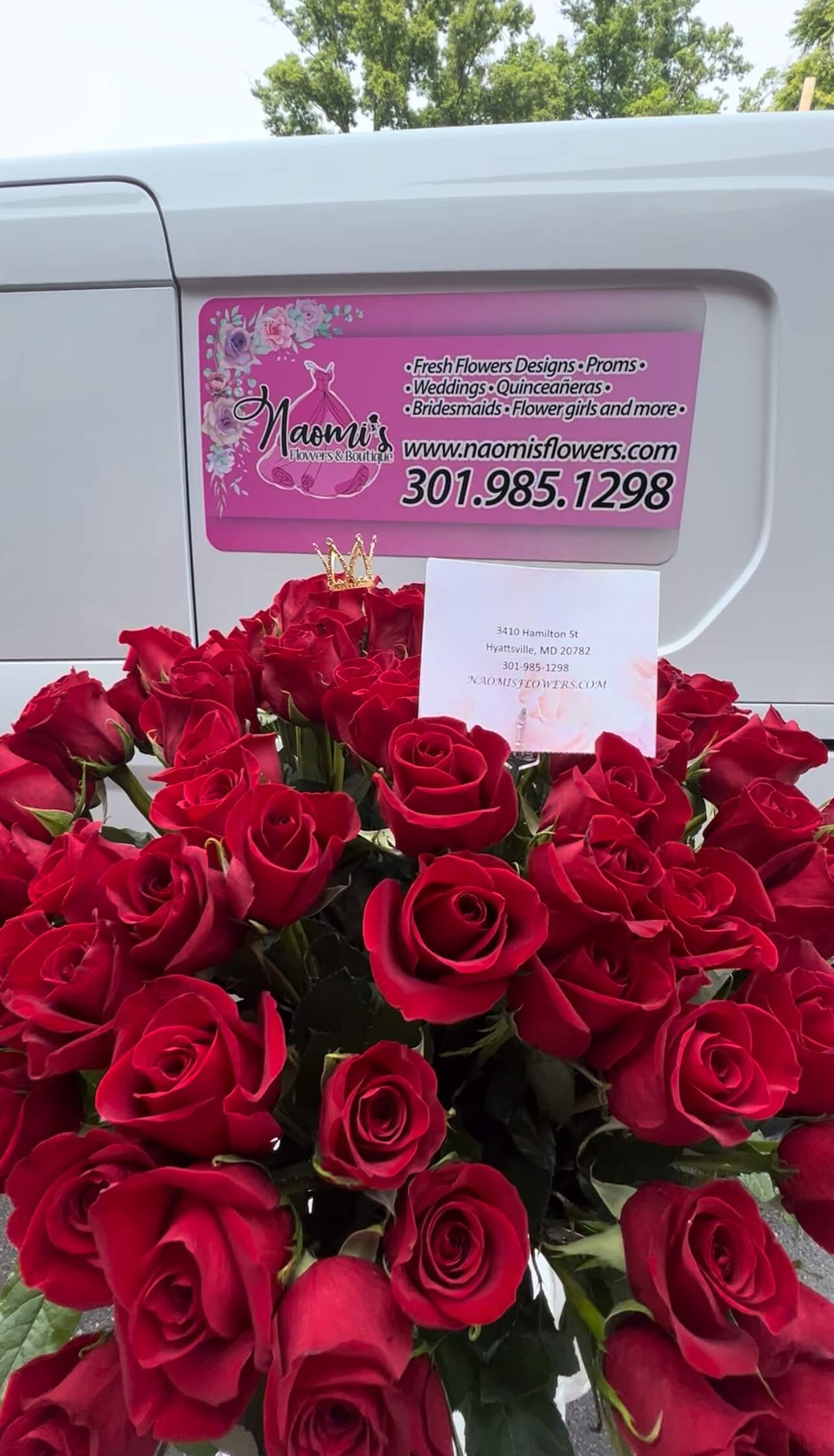 Woman smiling surrounde by neatly arranged tables