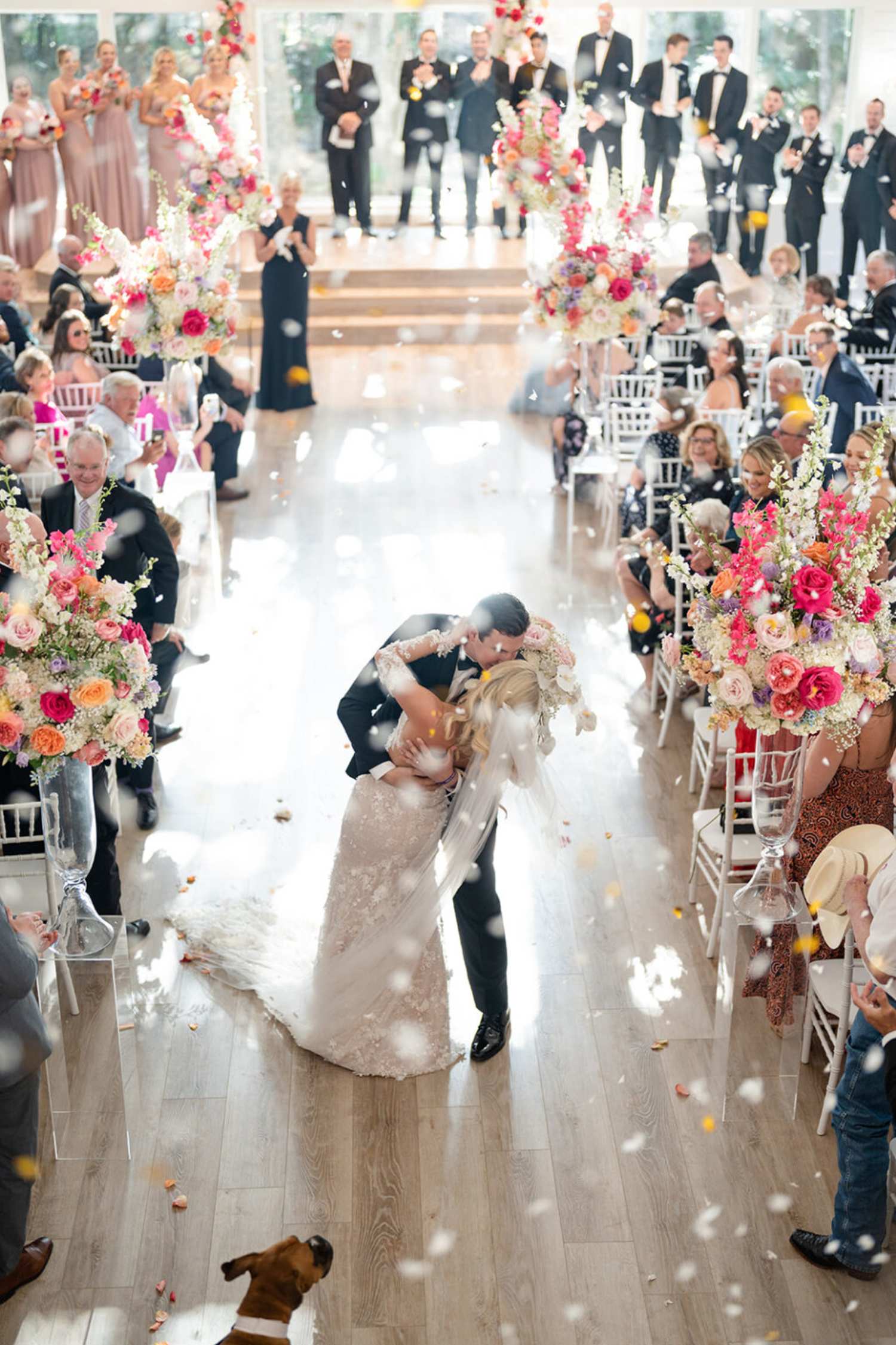Aisles decorated with pink and white flowers in wedding shots