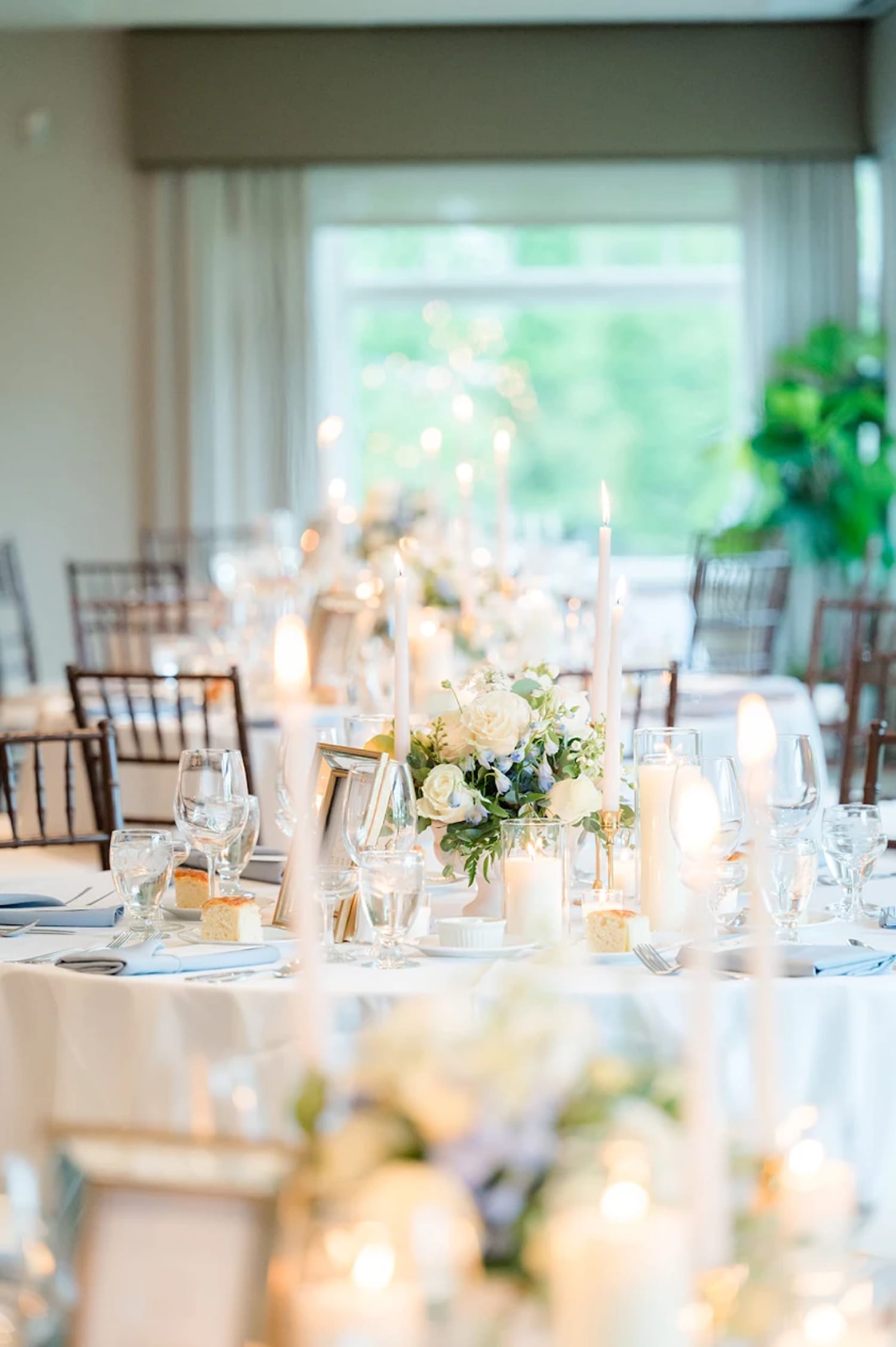 Long shot of reception tables with white center piece