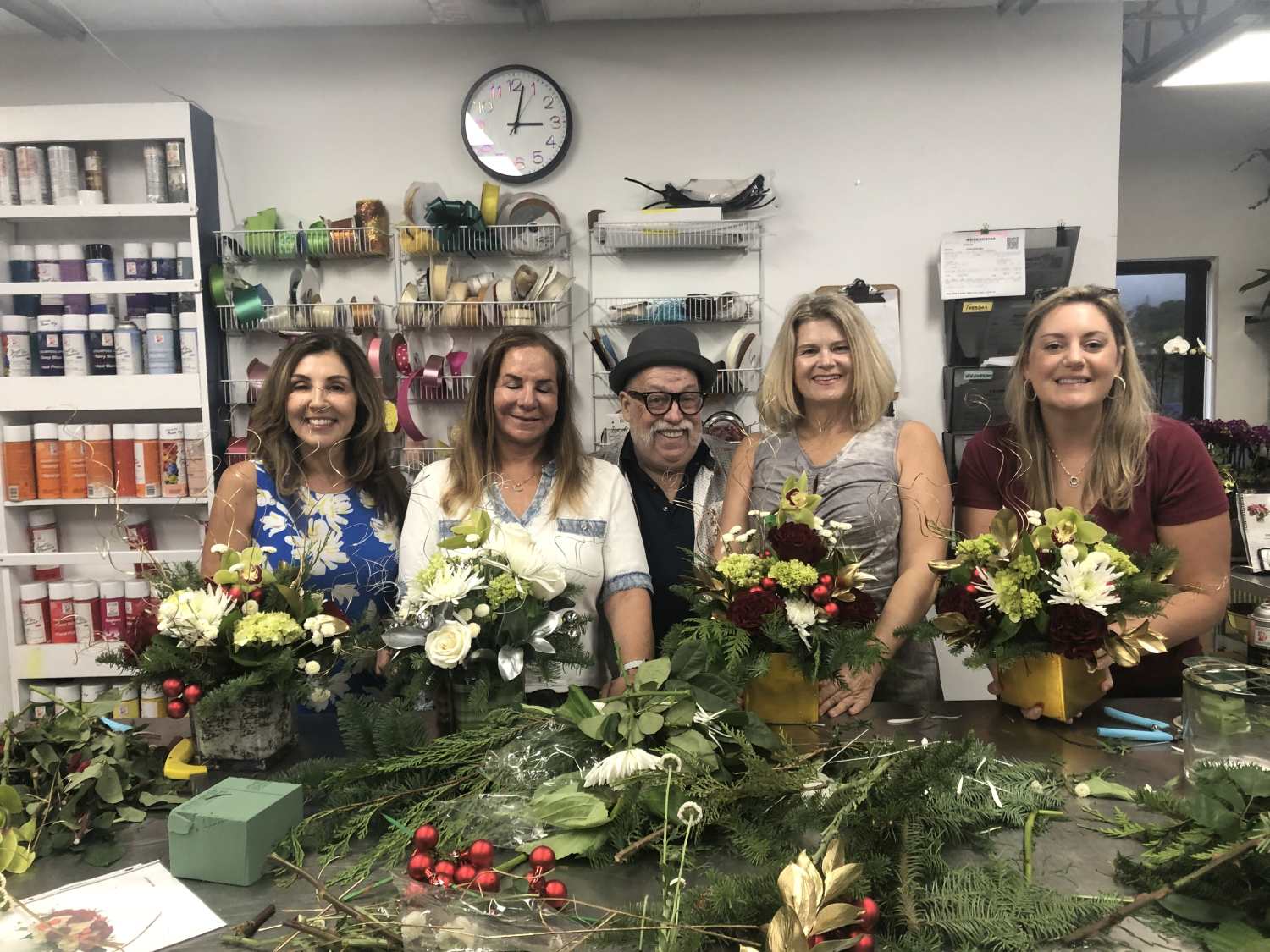 Group photo holding completed arrangements