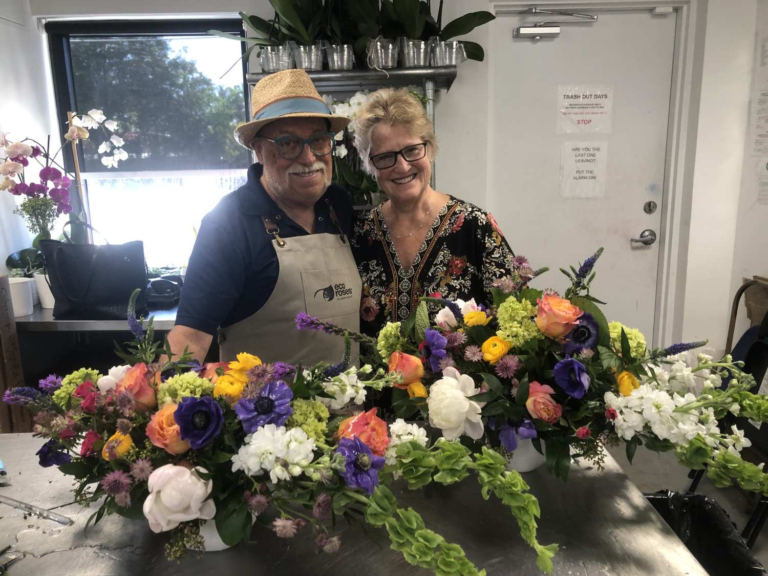 Pair poses with large table arrangement