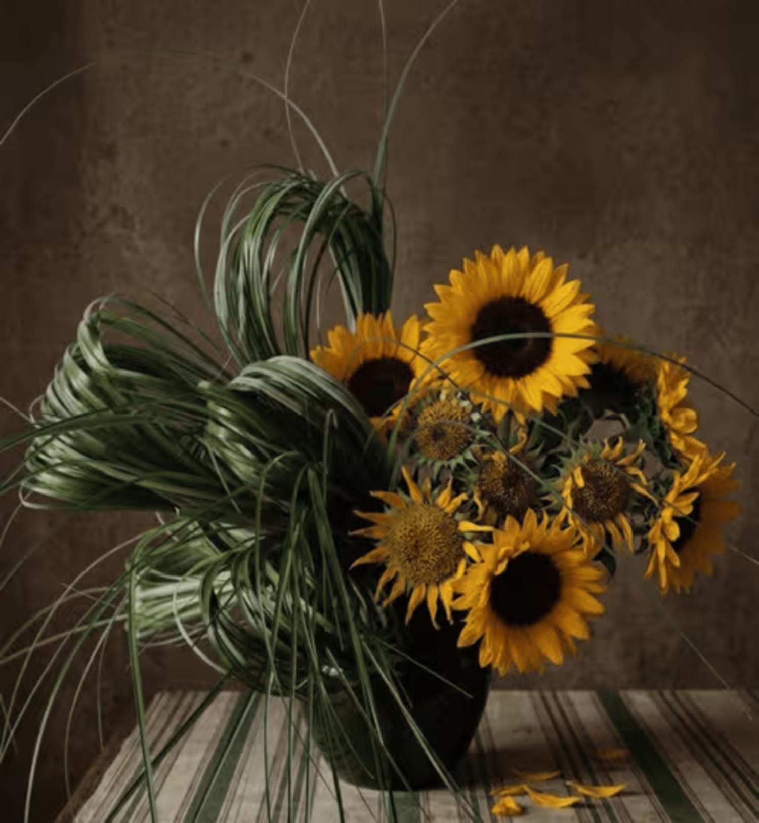 Concept for a garden-inspired fall arrangement featuring flowing bear grass, seasonal flowers, and natural movement.