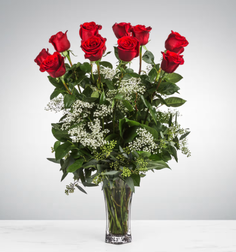 A dozen long stem red roses 