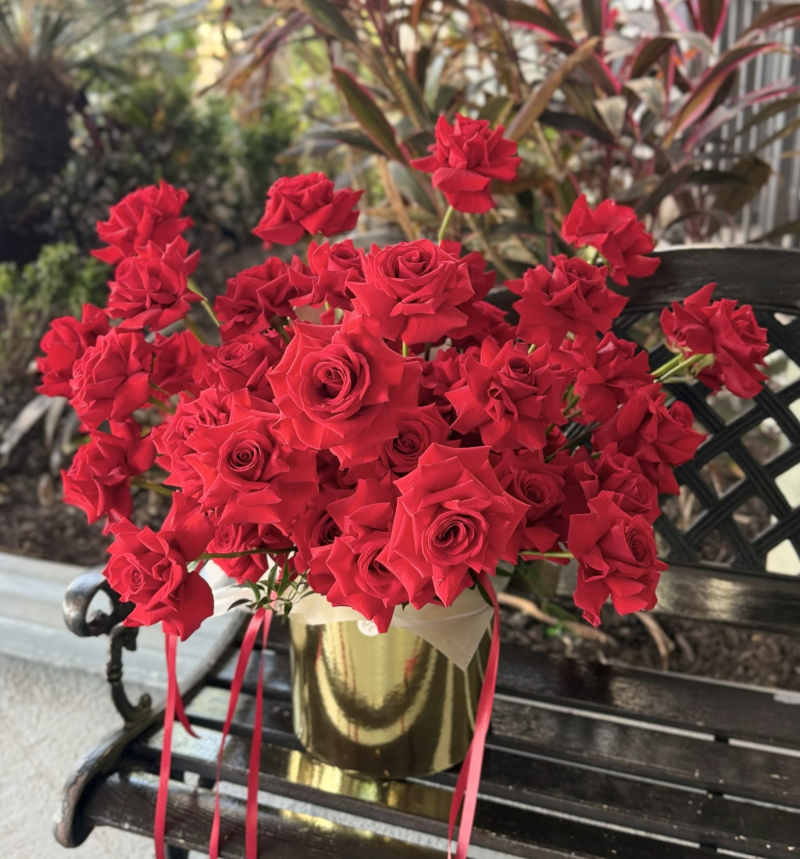 Large red rose floral arrangement.
