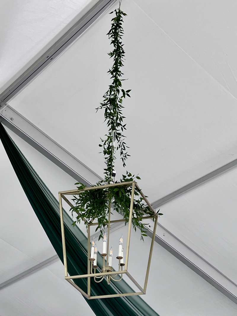 wedding reception greenery on lighting on ceiling