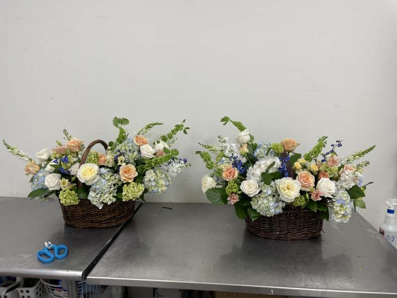 a Pair of Noble Passage Baskets