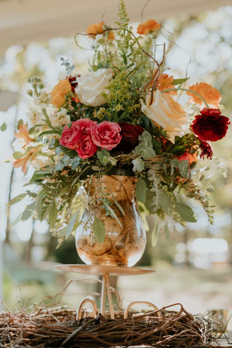 Garden-style floral arrangement with roses, seasonal flowers and greenery designed by Legacy Florals & Gifts.